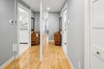 Main floor hallway with hardwood flooring throughout